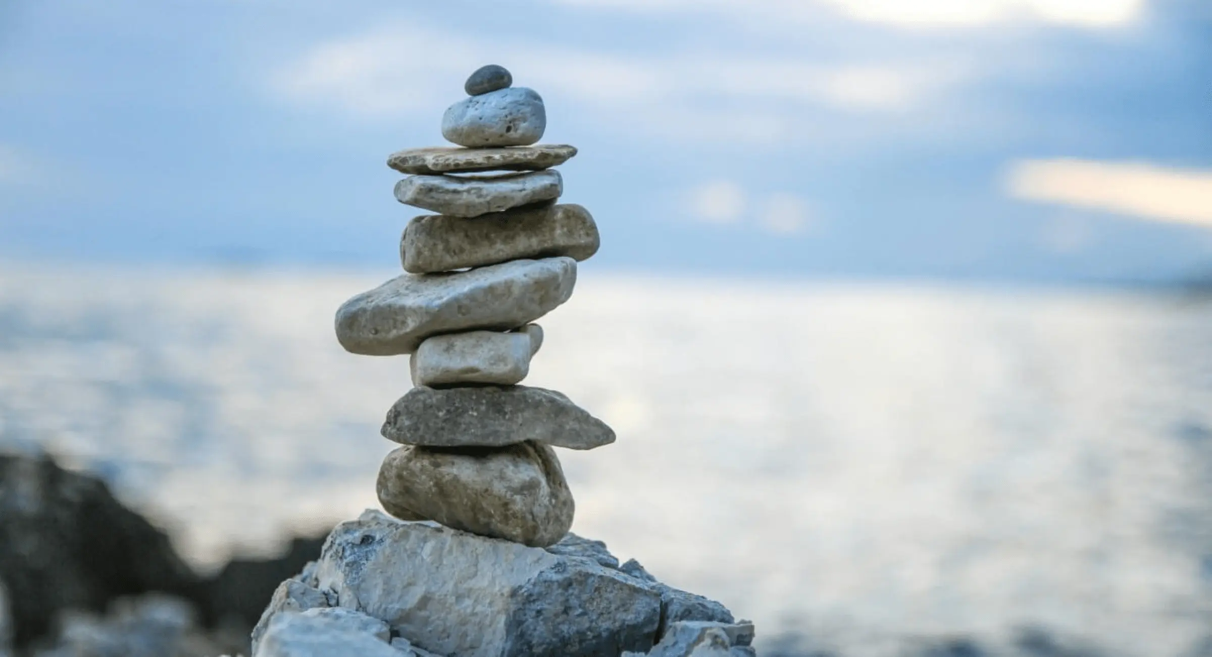 Zen stones and ocean backdrop